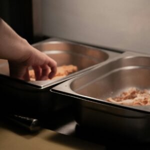 person holding stainless steel tray